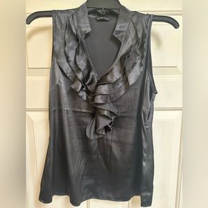 Silky, black top. Pairs well under blazer and tucked into slacks or jeans.